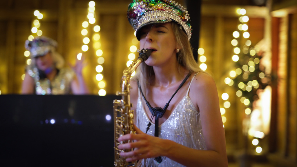 Saxophonist from Girls That Mix at a wedding party