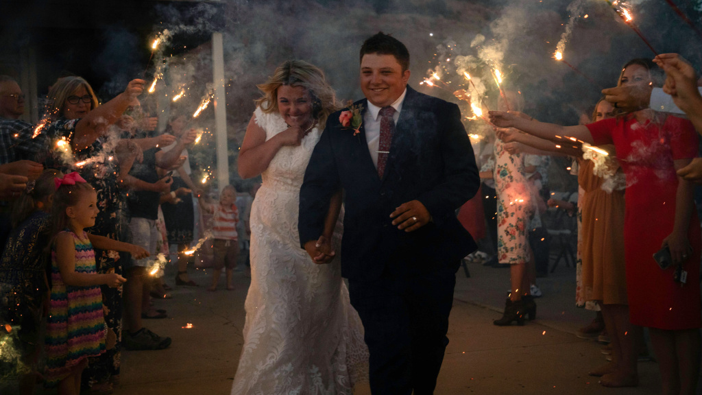 Couple exit wedding in a sparkler arch - London wedding film
